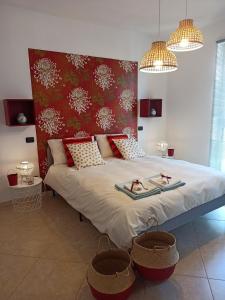 a bedroom with a large bed with two baskets on it at Fara one in Bari