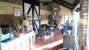 a living room with a table and chairs at Ferrum Ferrum in Valkenburg