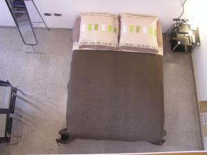 A bed or beds in a room at Art Transparent B&B