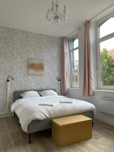 Säng eller sängar i ett rum på NG SuiteHome - Lille I Roubaix I Gare I Métro Alsace - Netflix - Wifi