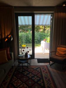 Posezení v ubytování Luxe B&B "In de Schulp", ontspan en geniet van comfort en stijl