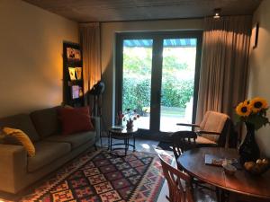 Posezení v ubytování Luxe B&B "In de Schulp", ontspan en geniet van comfort en stijl