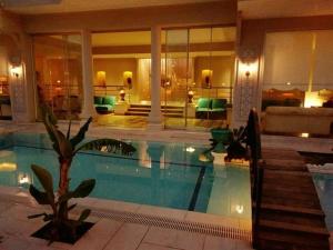 a hotel room with a swimming pool in a building at Dolunaydın Butik Otel in Side