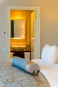 a hotel room with a bed and a sink at Elite World Istanbul Florya in Istanbul