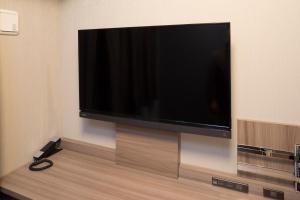 A television and/or entertainment center at Hotel WBF Namba Motomachi