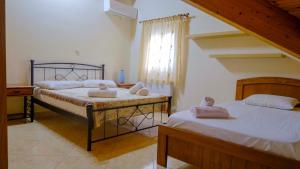 Posteľ alebo postele v izbe v ubytovaní Simona's Loft