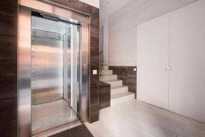 a walk in shower in a bathroom with stairs at Brand New, Specious Penthouse W, Private Terrace in Valencia
