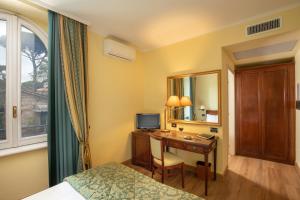 Katil atau katil-katil dalam bilik di Residence Verdeborgo