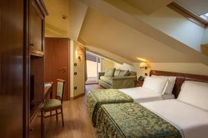 Katil atau katil-katil dalam bilik di Residence Verdeborgo