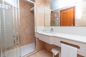 a bathroom with a sink and a shower at Aparto Residence Galetamar in Calpe