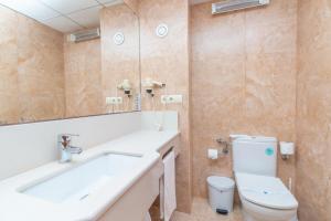 a bathroom with a sink and a toilet at Aparto Residence Galetamar in Calpe