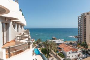 a view of the ocean from the balcony of a building at Aparto Residence Galetamar in Calpe