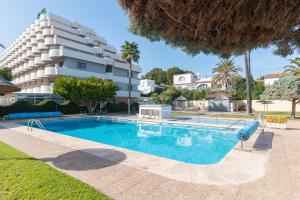 a large swimming pool in front of a building at Aparto Residence Galetamar in Calpe