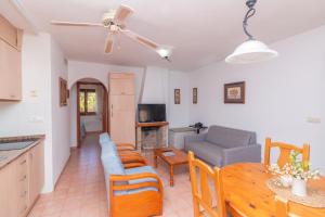 a living room with a couch and a table at Aparto Residence Galetamar in Calpe