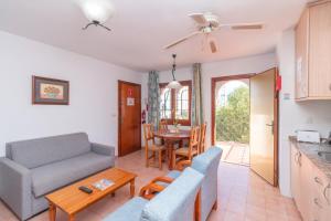 a living room with a couch and a table at Aparto Residence Galetamar in Calpe