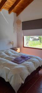 Ένα ή περισσότερα κρεβάτια σε δωμάτιο στο Mi casita en la loma
