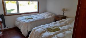 Een bed of bedden in een kamer bij Mi casita en la loma