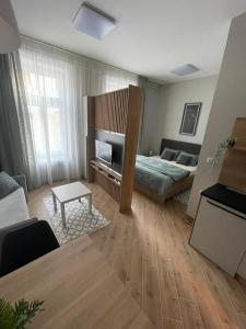 Cama o camas de una habitación en Manoir Apartments City Center