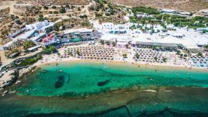 an aerial view of a beach with a crowd of people at Paradise Beach Resort in Paradise Beach