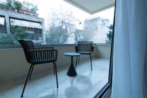 A balcony or terrace at Athenais Luxury Apartment