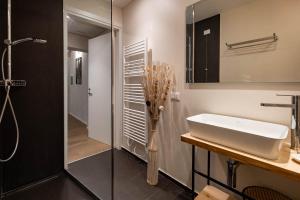 a bathroom with a sink and a shower at Verona Romana Apartments in Verona +68 photos