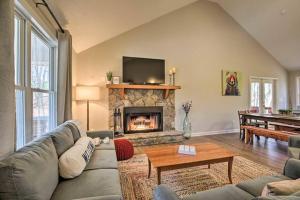 a living room with a couch and a fireplace at Less than 3 miles to Downtown with firepit in Ellijay