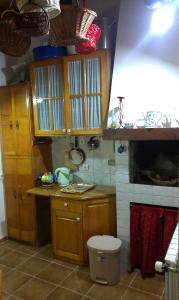 a kitchen with wooden cabinets and a counter top at Apartment City Garden in Kotor