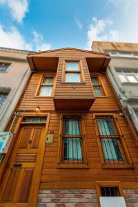 a wooden building with six windows on top of it at Double Q Apart in Istanbul
