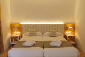 A bed or beds in a room at Sóller Center