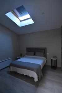 Łóżko lub łóżka w pokoju w obiekcie Casa A Pedra