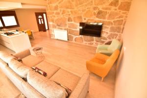 Telewizja i/lub zestaw kina domowego w obiekcie Casa A Pedra
