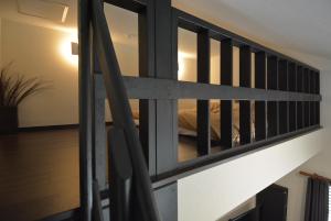 a staircase in a house with a railing at Hakone Mori No Yado in Hakone