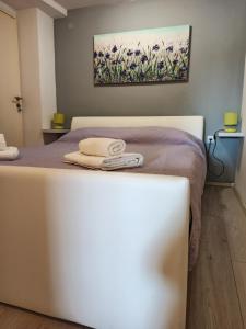 Posteľ alebo postele v izbe v ubytovaní Apartman Nola + 11 fotografií