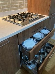 A kitchen or kitchenette at Gruppo Aedes Alghero, Residenza L'Isola - 200 mt dalla spiaggia