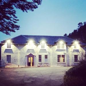 a large white building with lights on top of it at Isle of Skye Guest House in Kyleakin