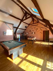 a large room with a pool table in it at La Ferme de Fontenelle in Amillis