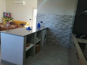 Kuchyňa alebo kuchynka v ubytovaní Villa Caterina