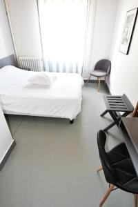 Postel nebo postele na pokoji v ubytování Le Pasteur