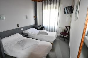Кровать или кровати в номере Le Pasteur