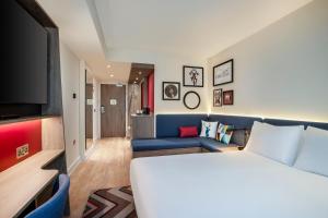 
a living room filled with furniture and a couch at Hampton By Hilton Bath City in Bath
