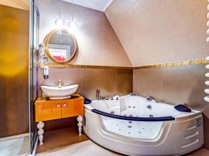 a bathroom with a tub and a sink at ROYAL PALACE Centrum Bankietowe in Sanok