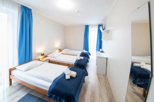 Posteľ alebo postele v izbe v ubytovaní Hotel Nowa Panorama