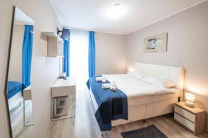 Posteľ alebo postele v izbe v ubytovaní Hotel Nowa Panorama