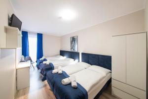 Posteľ alebo postele v izbe v ubytovaní Hotel Nowa Panorama