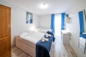 Posteľ alebo postele v izbe v ubytovaní Hotel Nowa Panorama