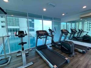 a gym with several treadmills in a building at MARITIME SUITE DUPLEX PENANG- PEMANDANGAN LAUT in George Town
