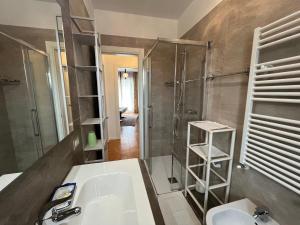 a bathroom with a sink and a shower at Haus Romagnoli Residence in Lazise