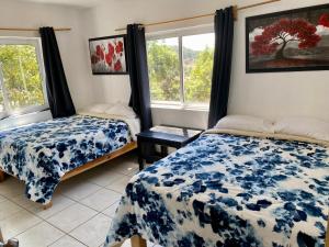 Postel nebo postele na pokoji v ubytování Herradura VIP Inn