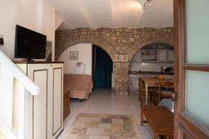 TV a/nebo společenská místnost v ubytování CASA NEL BORGO