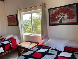 Postel nebo postele na pokoji v ubytování Herradura VIP Inn
